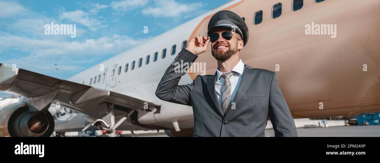 Joyful aircraft pilot standing hi-res stock photography and images - Alamy