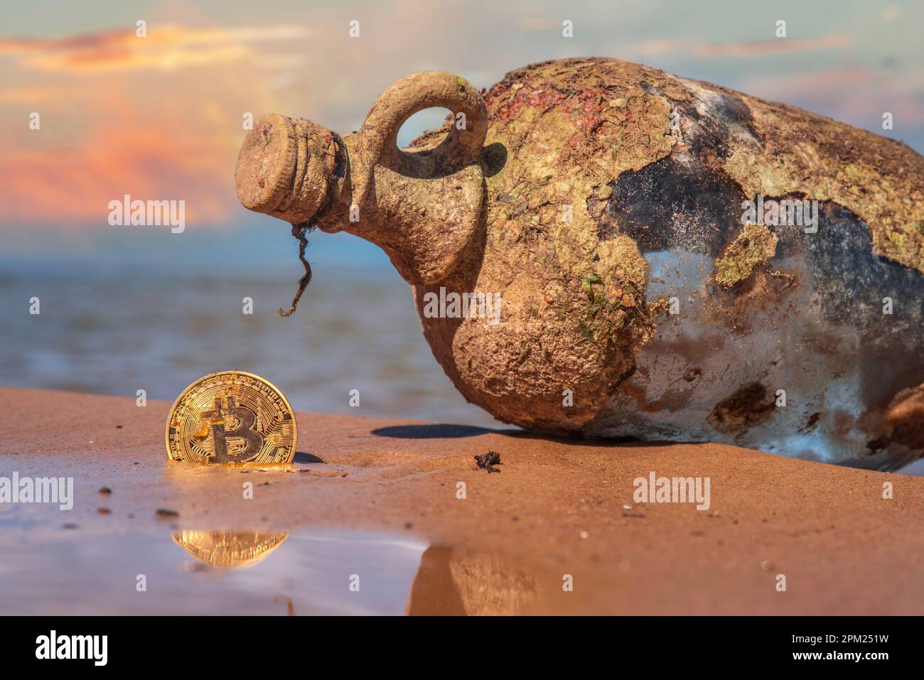 ancient treasure on the seashore. Gold coins in the form of bitcoin Stock  Photo - Alamy