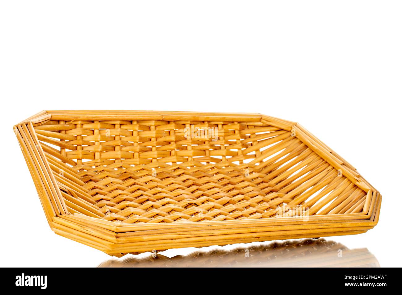 Single wicker basket made of vines, macro, isolated on white background