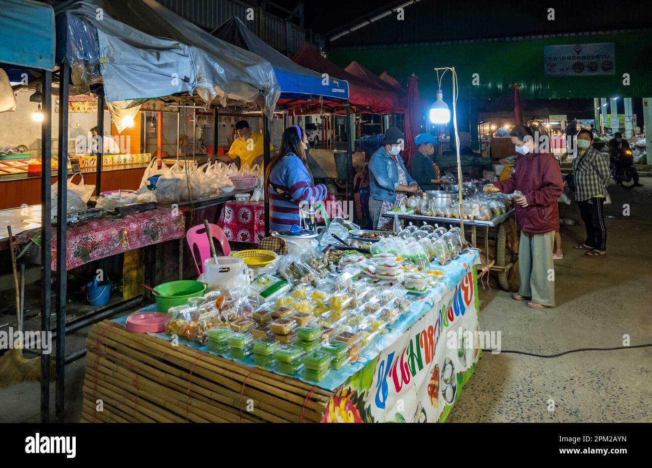 Varieties of street food served at a night market. Khlong Lan, Thailand. Stock Photo