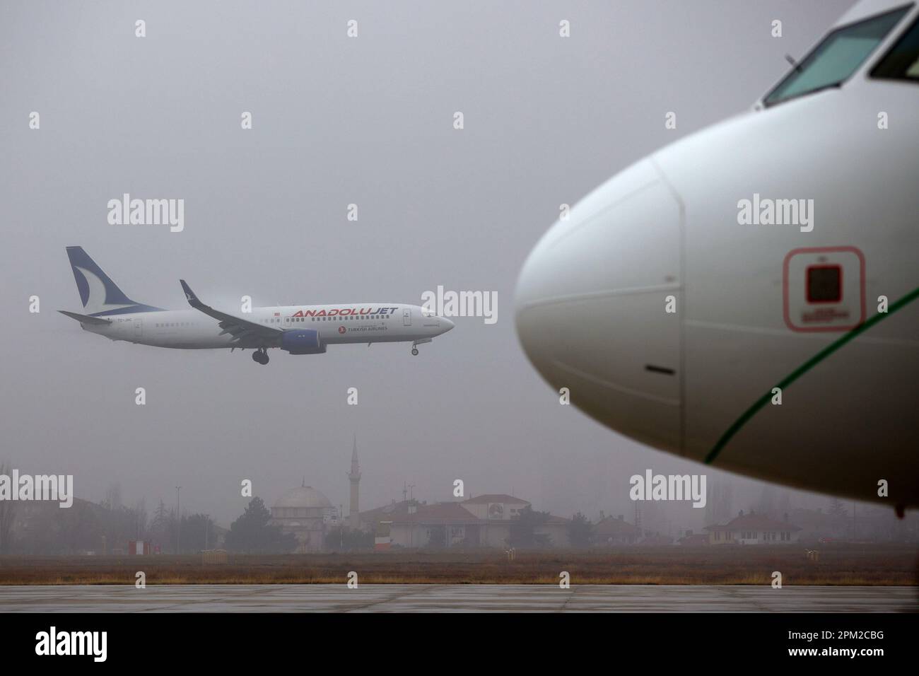 Ankara, Turkey - 18 December, 2022: AnadoluJet airplane of Turkish Airlines lands on Ankara Esenboga Airport. Stock Photo