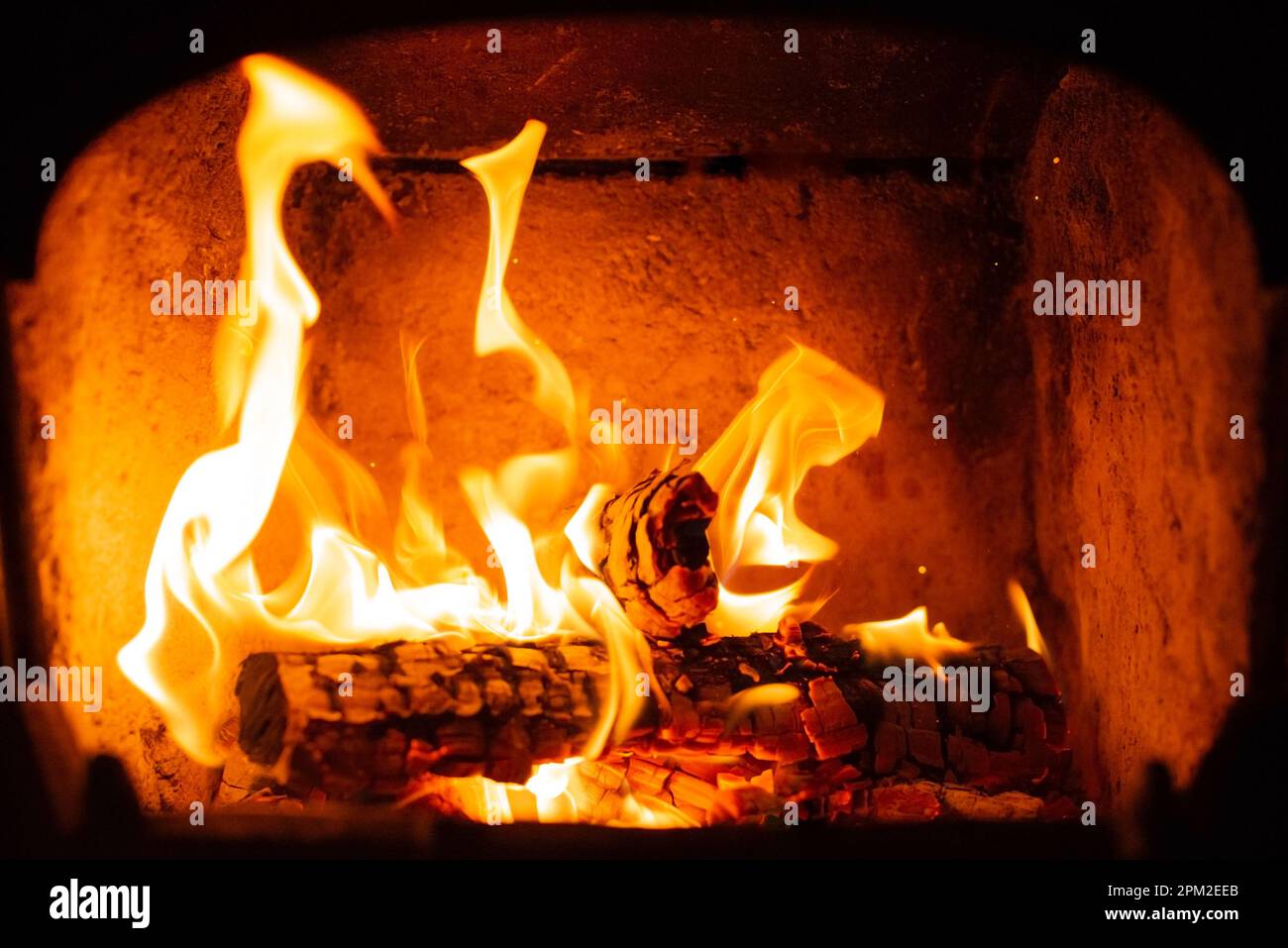 Flame of Wooden logs being burn inside stove Stock Photo Alamy