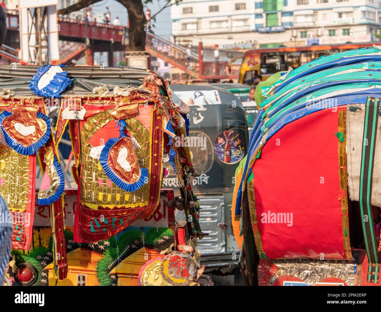 Colourful tricycle taxis in heavy traffic in Dhaka, Bangladesh. Stock Photo
