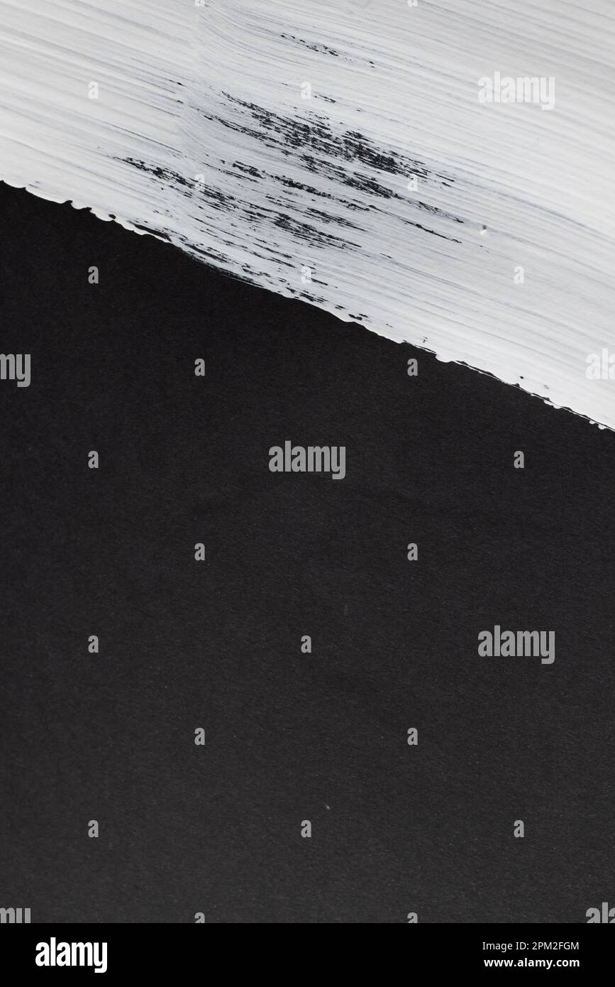 Close up of white paint stripe on black background with copy space