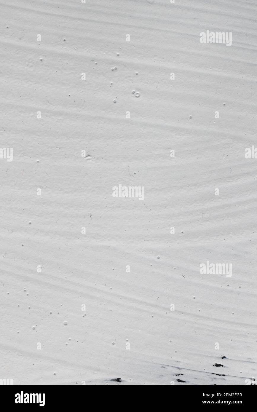 Close up of white paint on black background with copy space Stock Photo