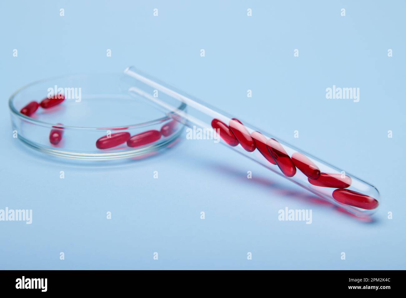 Red translucent gelatin capsules with fatsoluble vitamin E, inside a