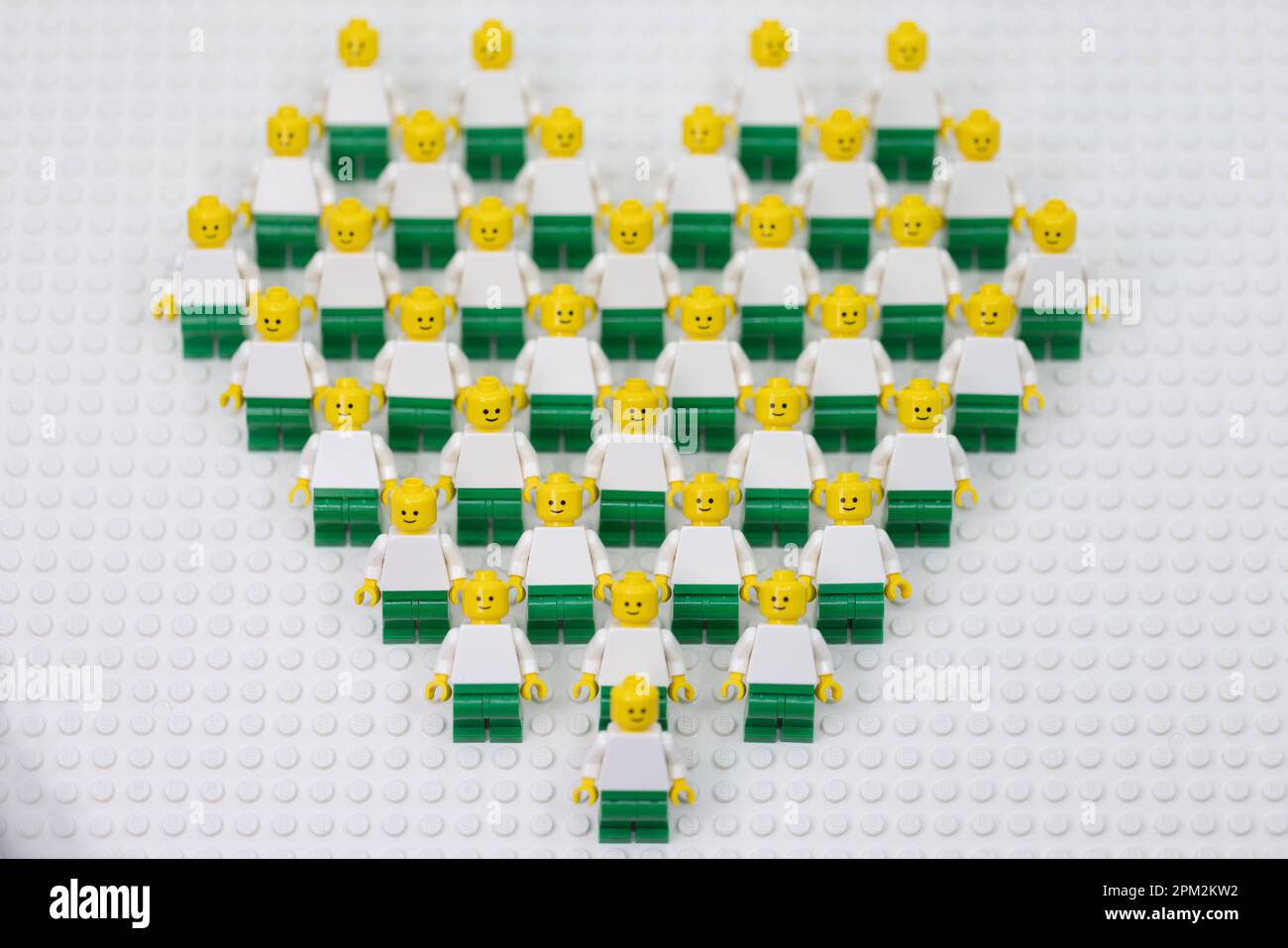 Hong Kong -April 11 2023: many man dress in same pant, and form as a heart shaped group Stock Photo