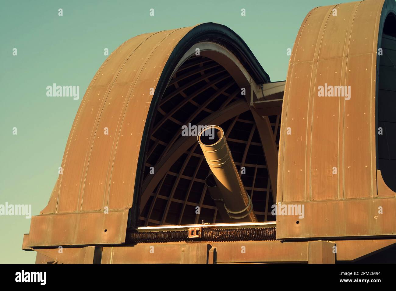 The photo depicts the telescope of Griffith Observatory in Los Angeles