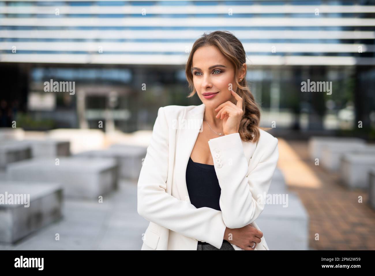 Portrait of a young smiling business woman outdoor Stock Photo - Alamy