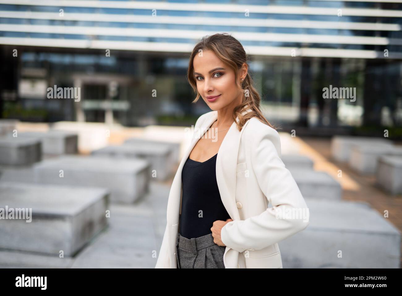 Portrait of a young smiling business woman outdoor Stock Photo - Alamy