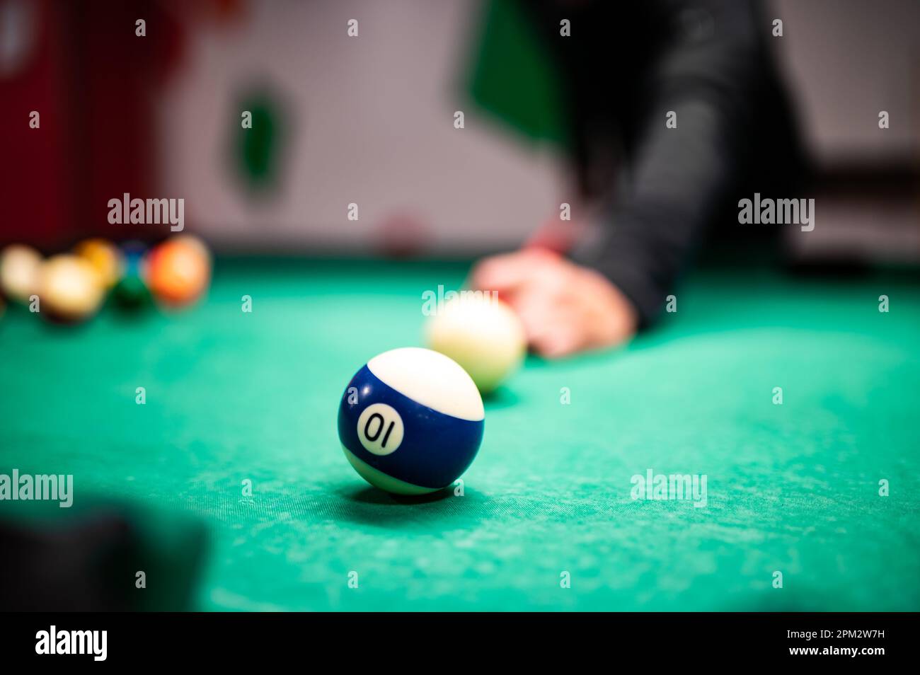 Young man playing snooker, aiming. for a good shot Stock Photo - Alamy