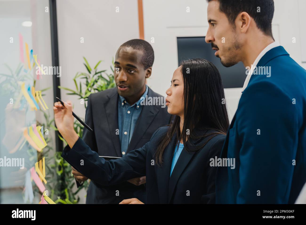 Diverse colleagues discussing project in office Stock Photo