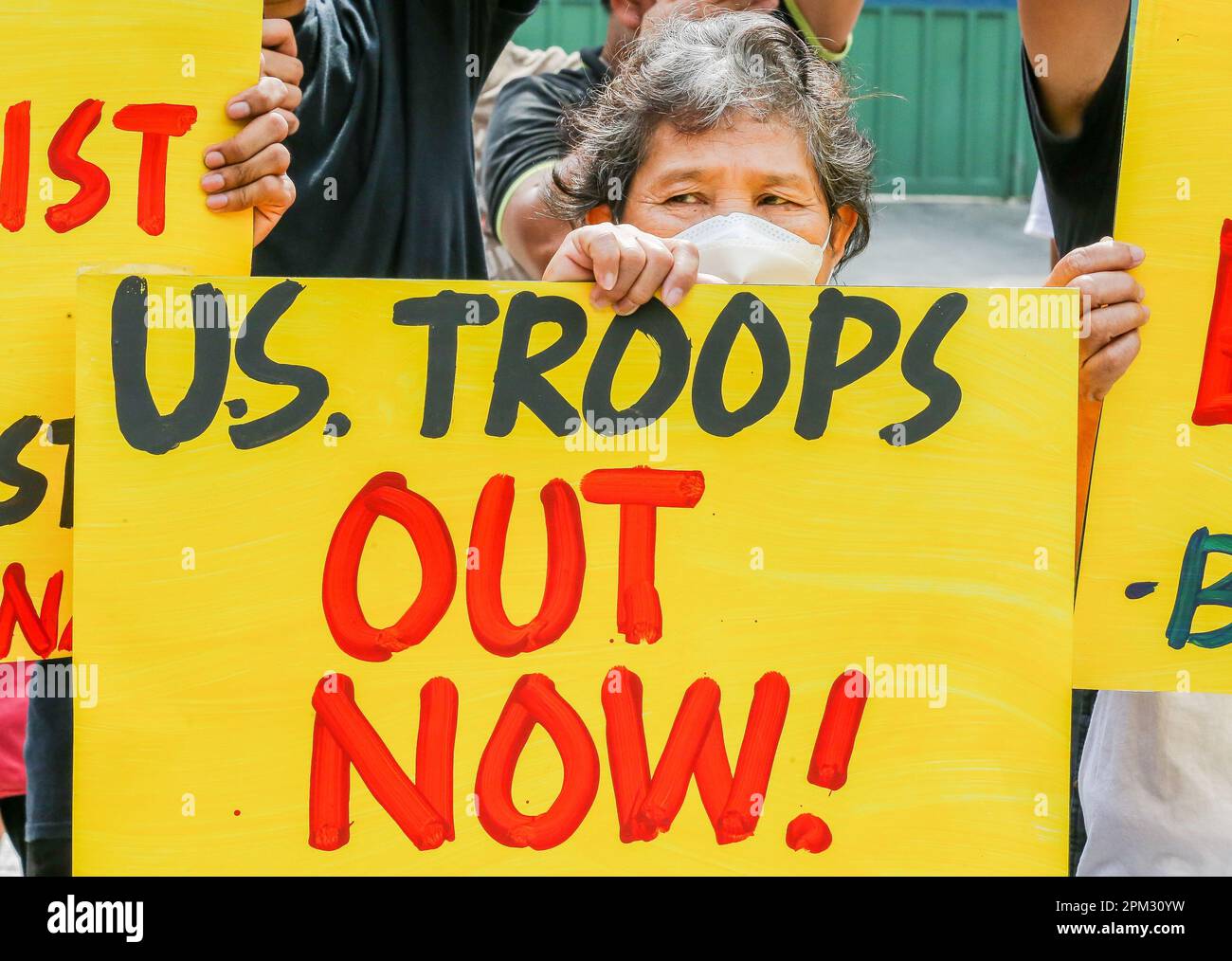 Quezon City, Philippines. 11th Apr, 2023. People hold placards during a protest rally against the U.S.-Philippines Balikatan joint military exercises in front of the gate of the Armed Forces of the Philippines (AFP) headquarters in Quezon City, the Philippines, April 11, 2023. More than 17,000 Philippine and U.S. troops on Tuesday kicked off the most extensive joint military activities in decades in the Philippines amid criticisms that it escalates tension in the region rather than peace and stability. Credit: Rouelle Umali/Xinhua/Alamy Live News Stock Photo
