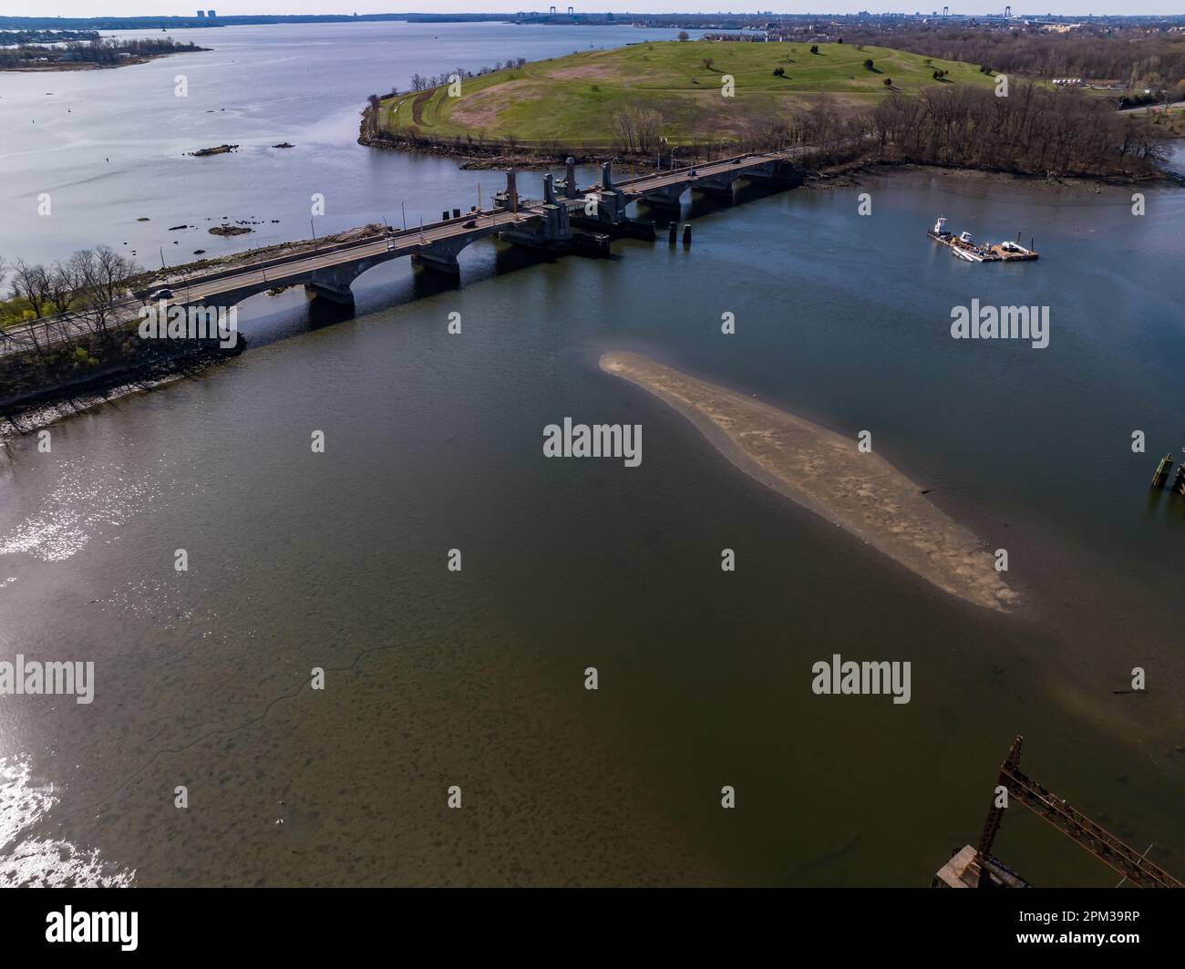 An aerial view over the Pelham Bay Bridge on a sunny morning in the