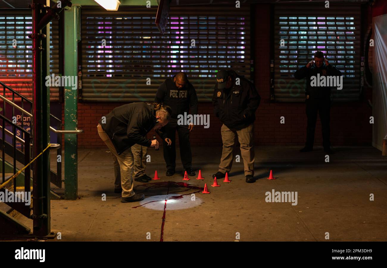 Crime scene unit investigate the scene where two teenagers were shot