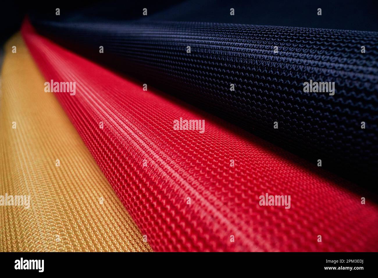 Macro view of the weaving structure of the German flag under the light