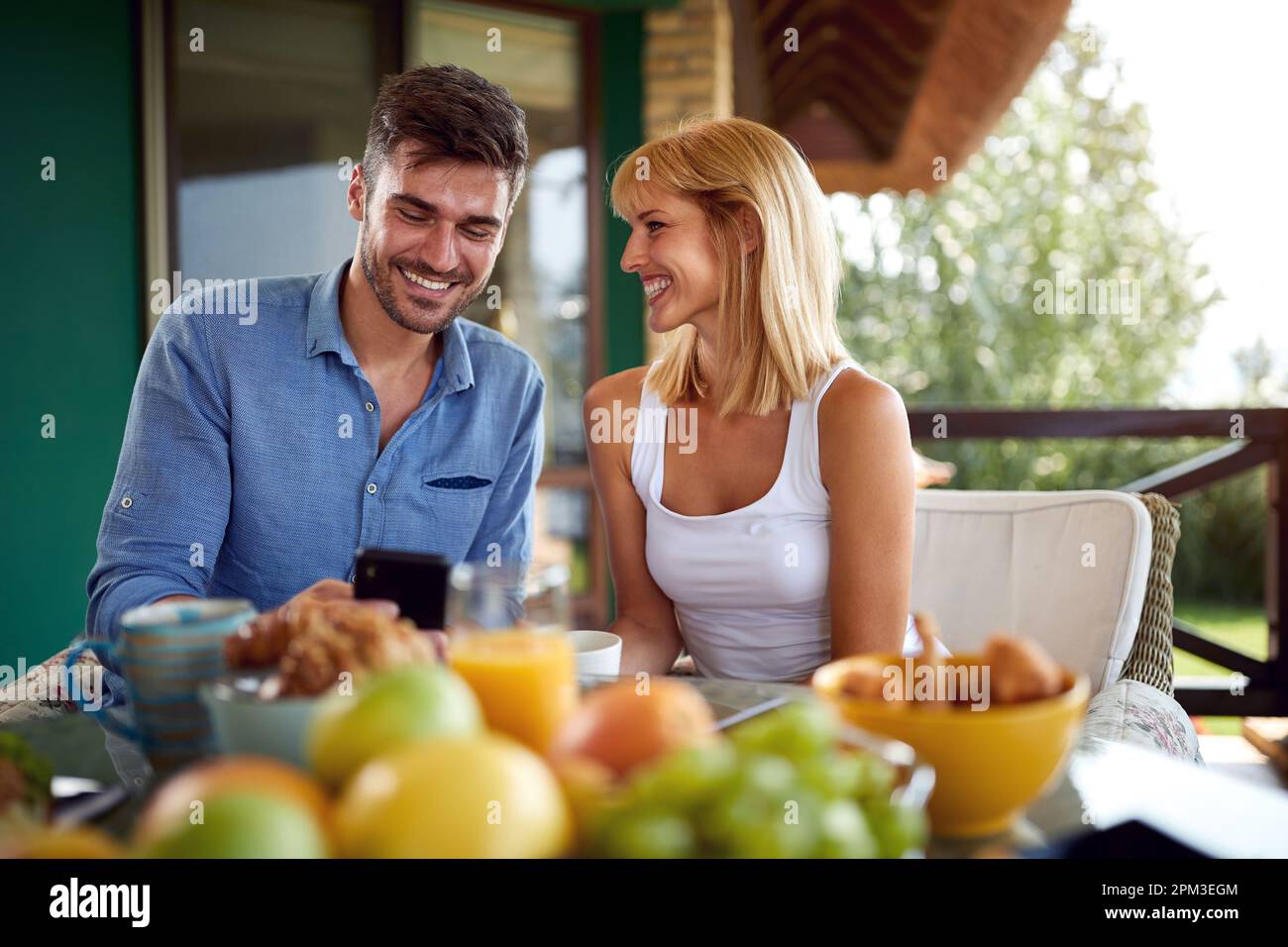 Young couple enjoying on terrace Stock Photo