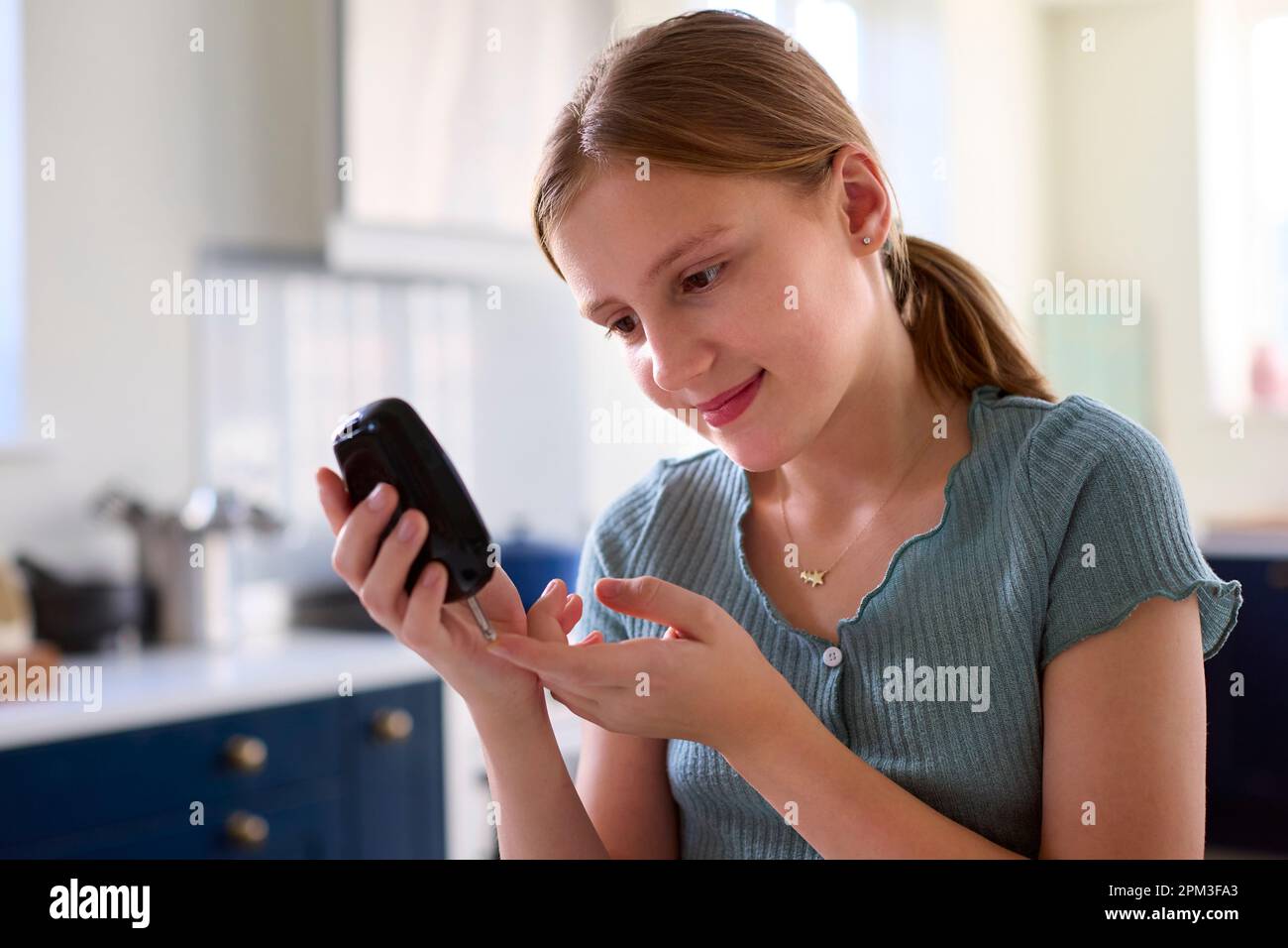 Diabetic Girl At Home Testing For Blood Glucose Level With Monitor Kit
