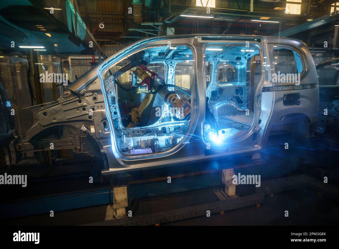 Robot arm welding at an automatized car factory Stock Photo