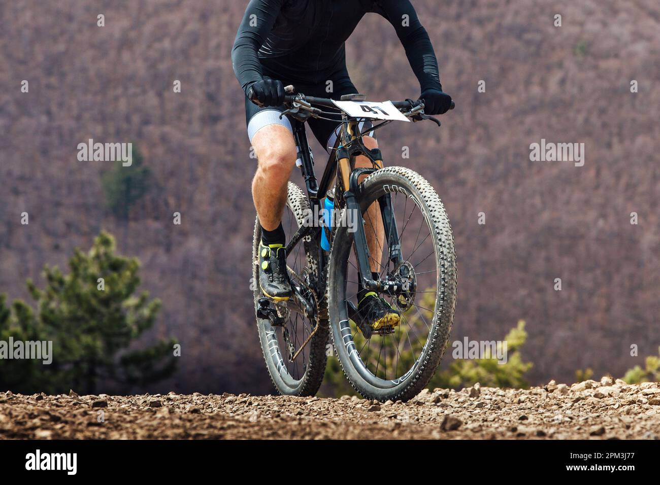 close-up cyclist riding mountain bike in cross-country cycling, wheels sports mountainbike Stock Photo