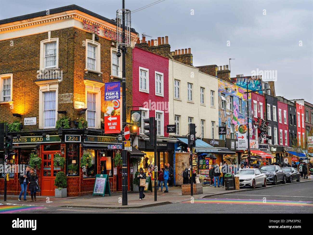 Camden Town, London, UK: Camden High Street in the early evening with colorful buildings and people. Stock Photo