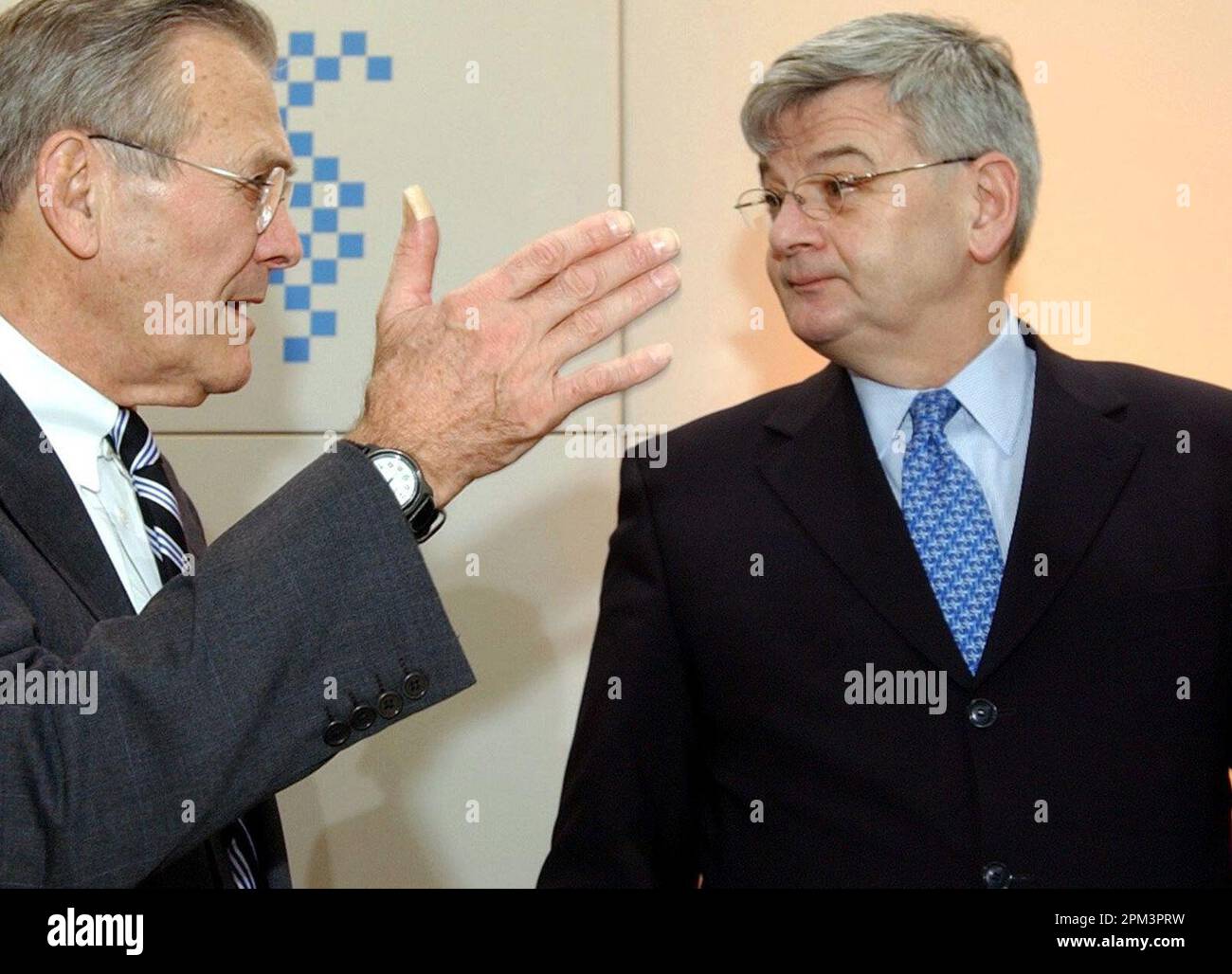 Munich, Germany. 08th Feb, 2003. With his hand raised, then U.S. Defense Secretary Donald Rumsfeld (l) talks with then German Foreign Minister Joschka Fischer at the start of the 39th International Security Conference in Munich. Fischer, parliamentary group spokesman for Alliance 90/The Greens in the German Bundestag from 1994 to 1998, and foreign minister and vice chancellor of the Federal Republic of Germany from 1998 to 2005, was born in Gerabronn in Baden-Württemberg on April 12, 1948. Credit: Matthias Schrader/dpa/Alamy Live News Stock Photo