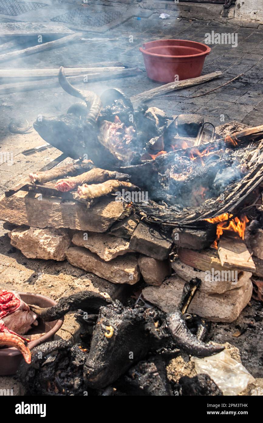 A lamb's head being burned on the streets of Casablance for Eid