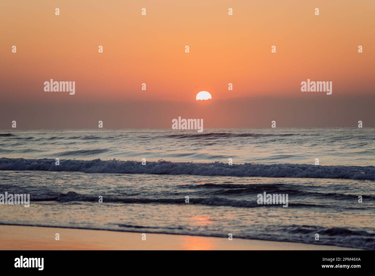 Landscape with sea sunset on the beach Stock Photo - Alamy