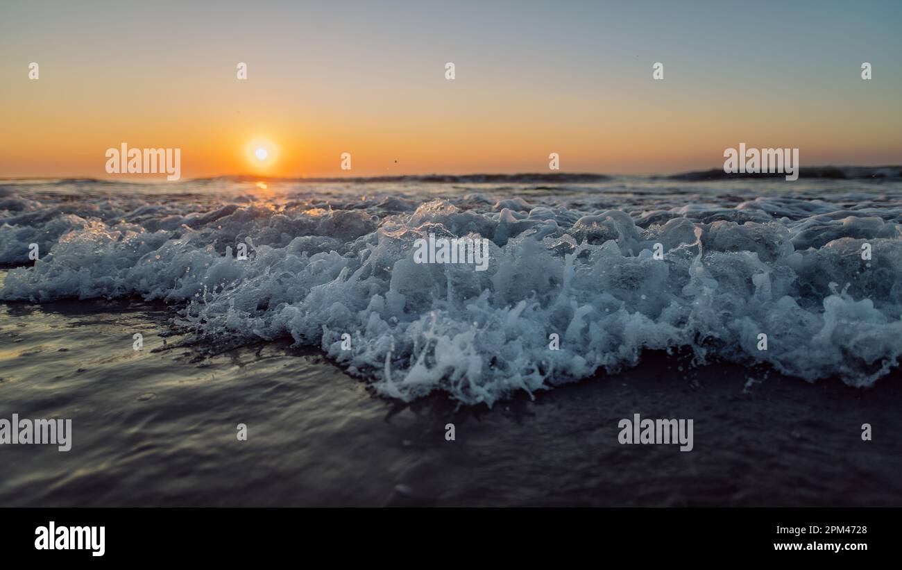 Landscape with sea sunset on the beach Stock Photo - Alamy