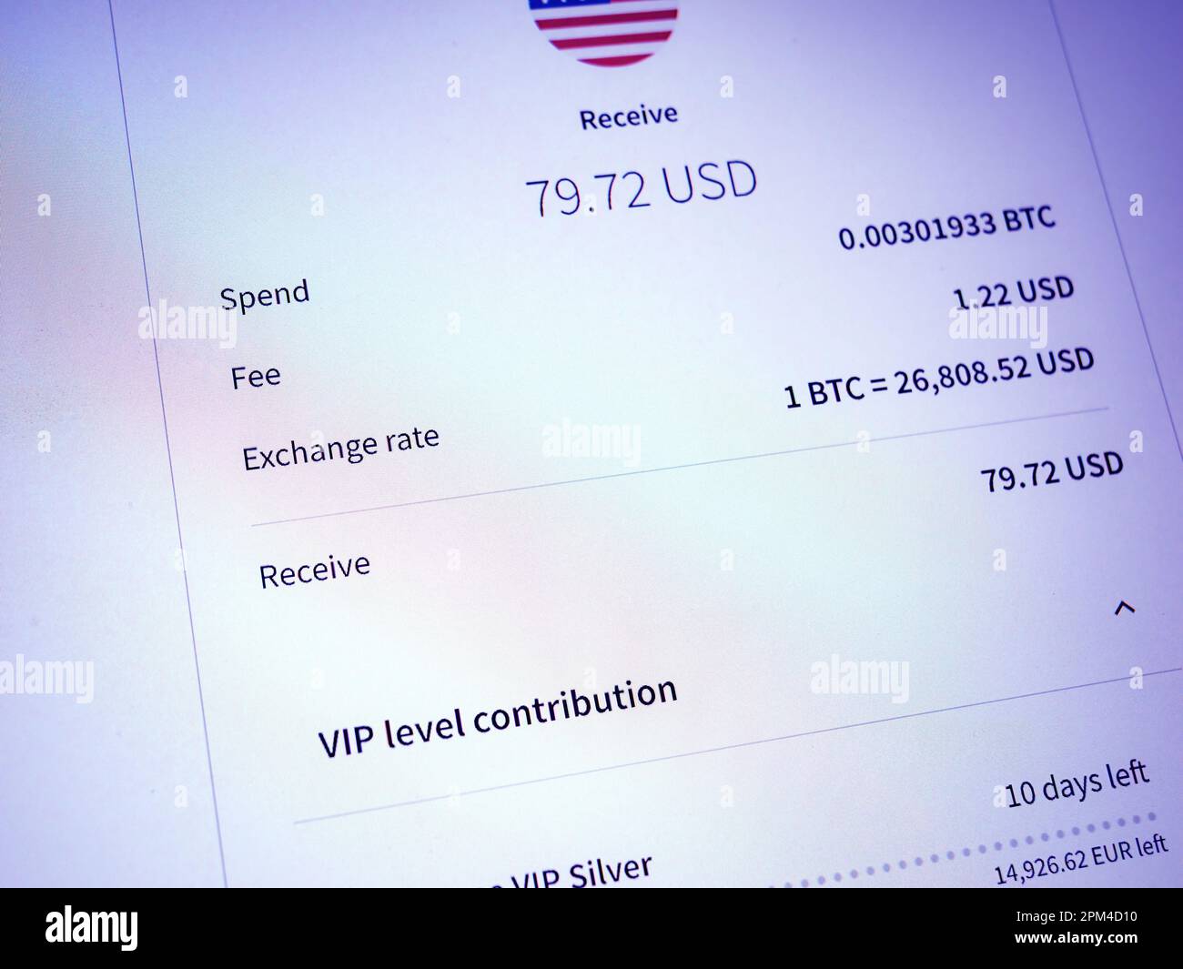 Vienna, Austria, Mar 22, 2023: A close-up of a background with text,  graphs, and documents about bitcoin mining, exchange rates, fees and more.  A trader reviews order details to spend or receive