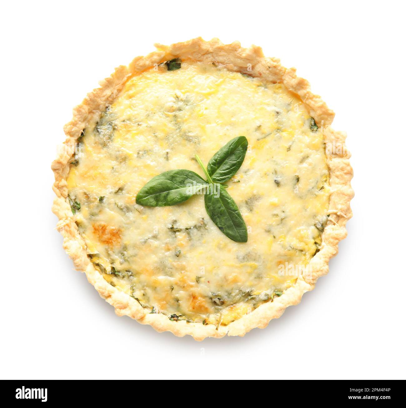 Delicious quiche with spinach leaves isolated on white background Stock