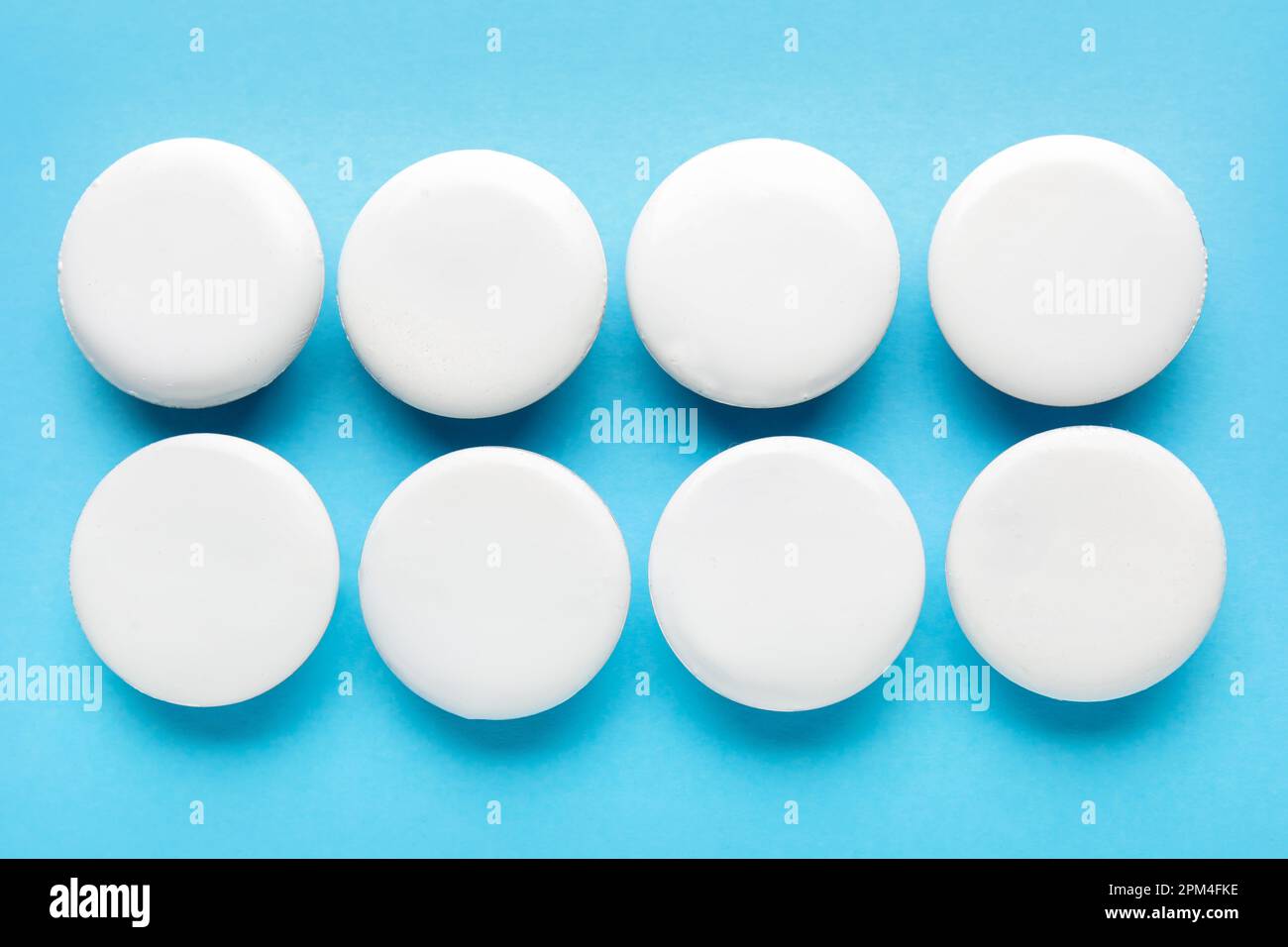 Blank white badges on blue background Stock Photo - Alamy
