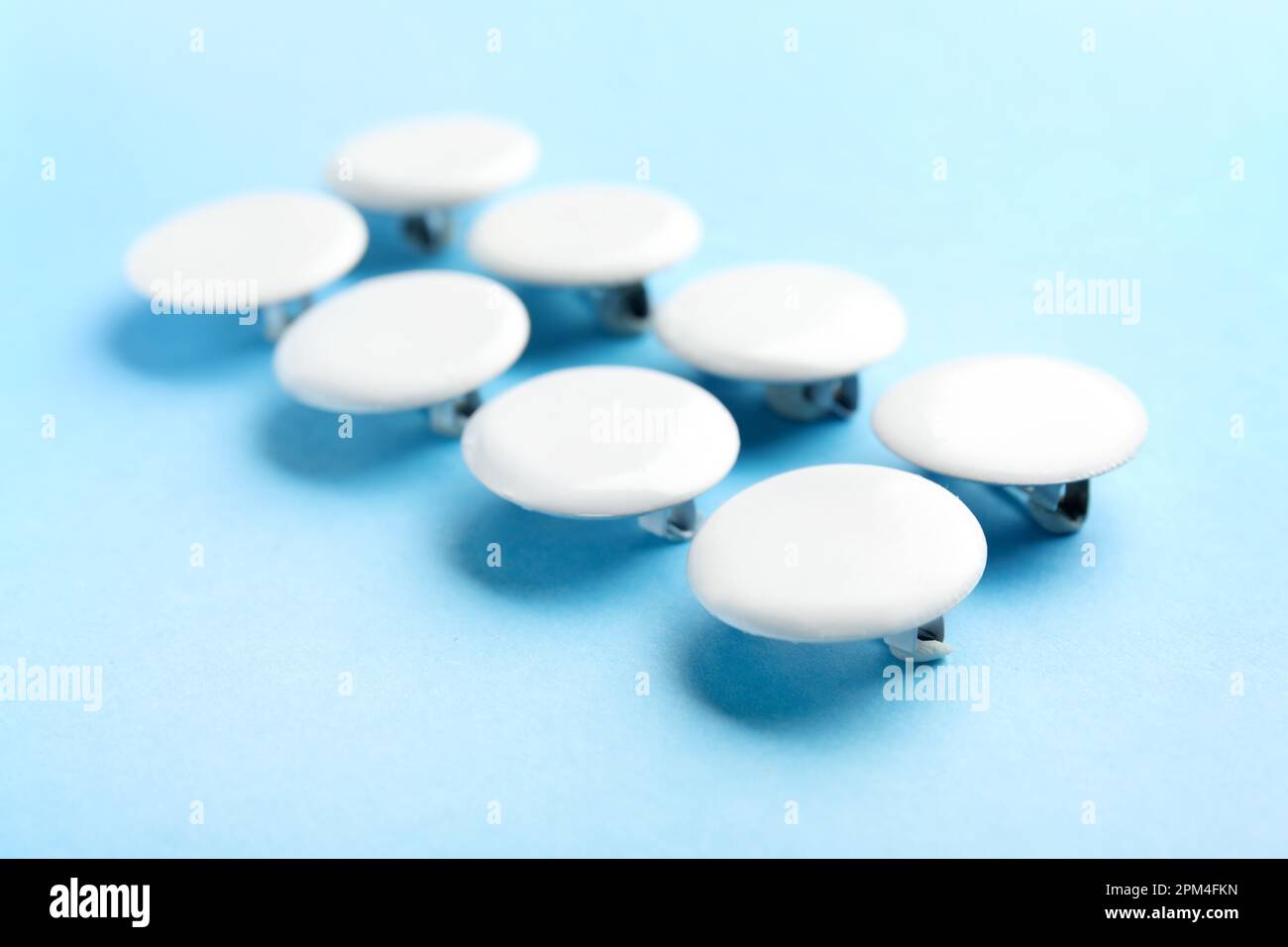 Blank white badges on blue background Stock Photo - Alamy