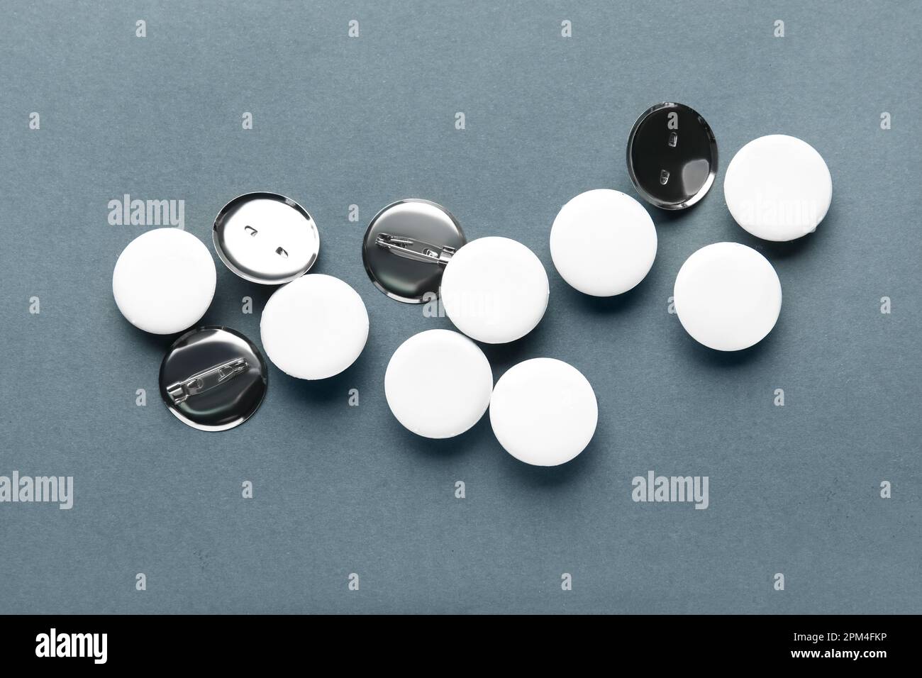 Blank white badges on grey background Stock Photo - Alamy