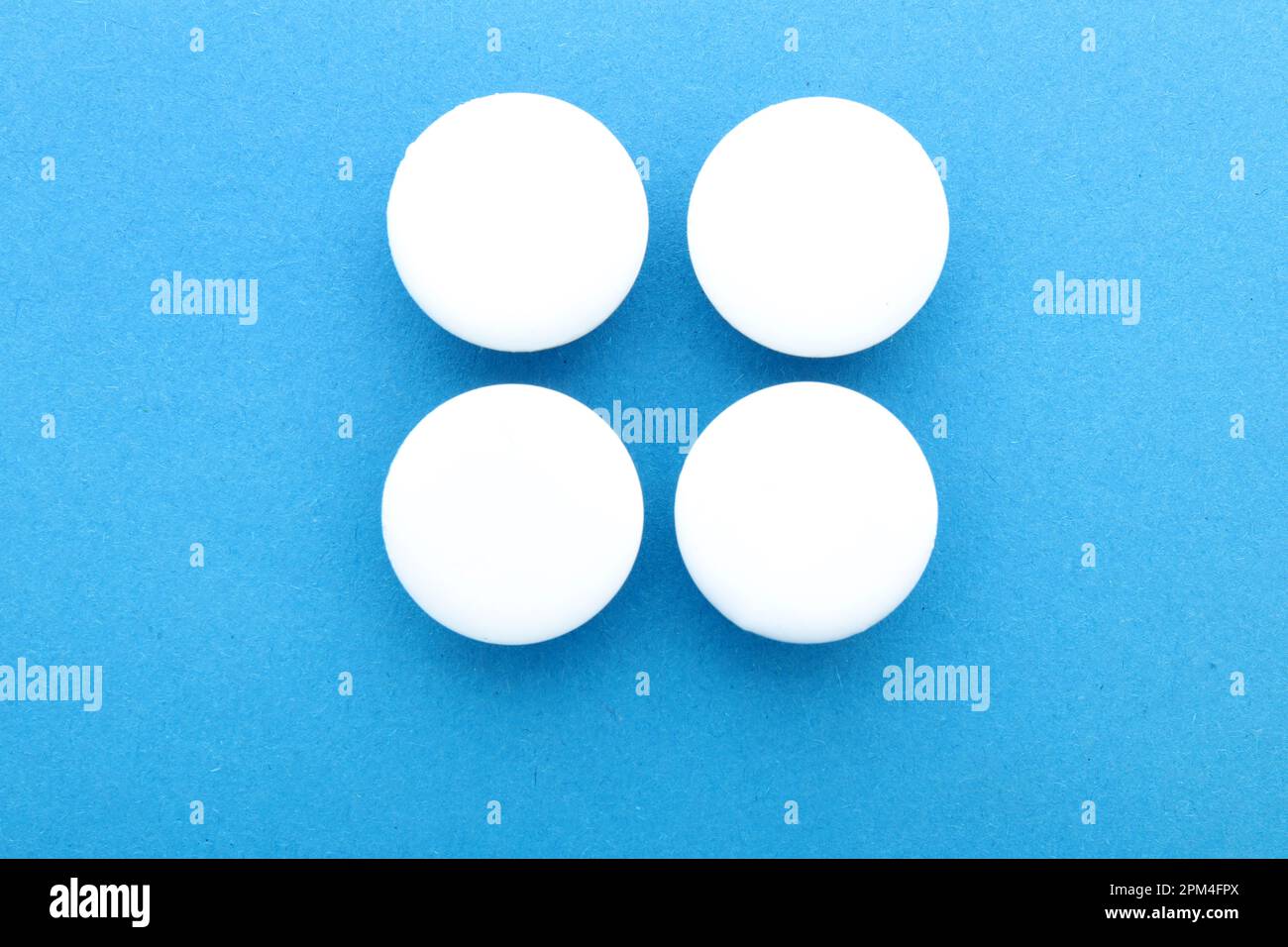 Blank white badges on blue background Stock Photo - Alamy