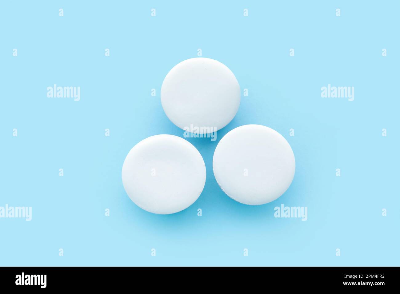 Blank white badges on blue background Stock Photo - Alamy