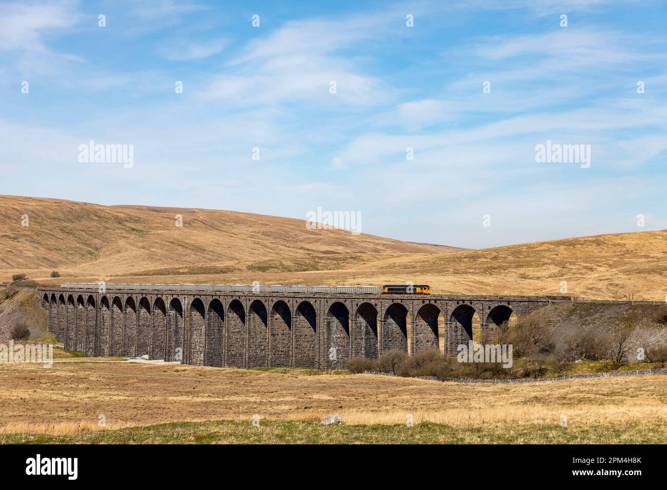 diesel goods train heading south across ribblehead viaduct in the yorkshire dales summer day Stock Photo