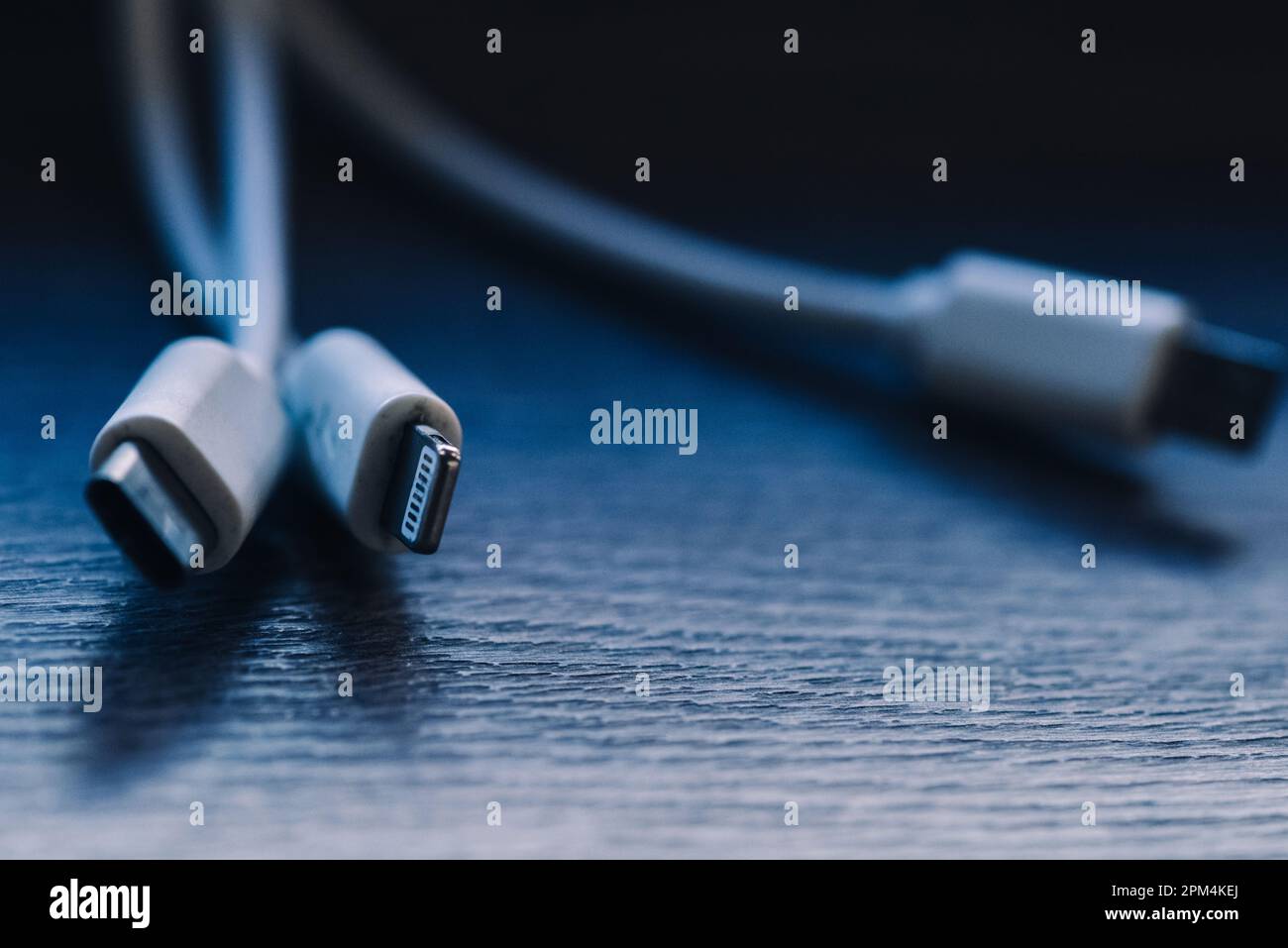 Charger cables in macro style from wall at a cafe Stock Photo