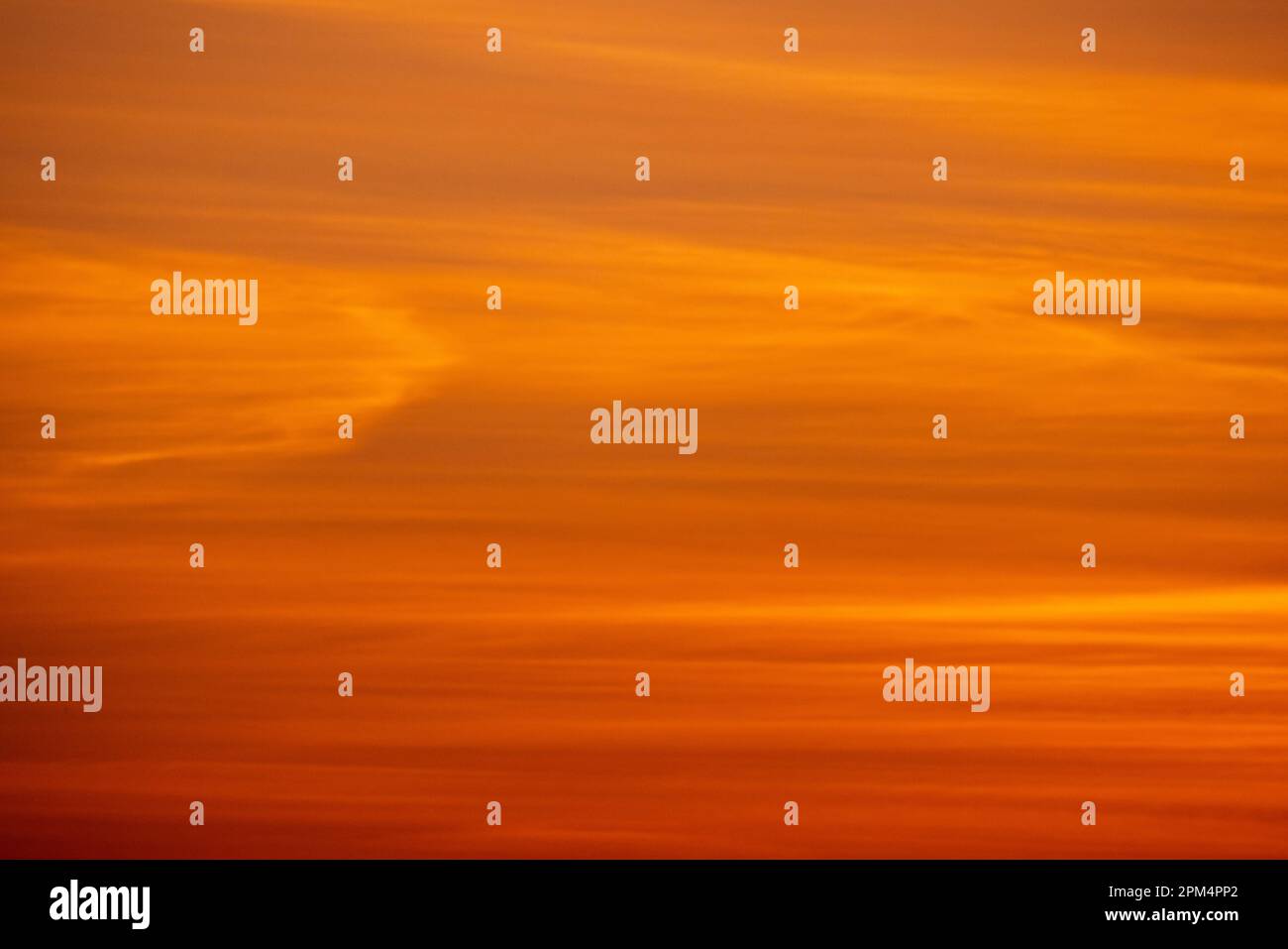 Red cloudy tropical sky on a sunset, blurred background photo Stock Photo