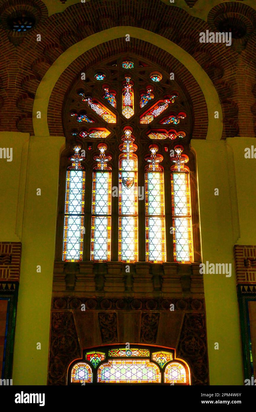 Old fashioned stained glass window in the building interior. Antique