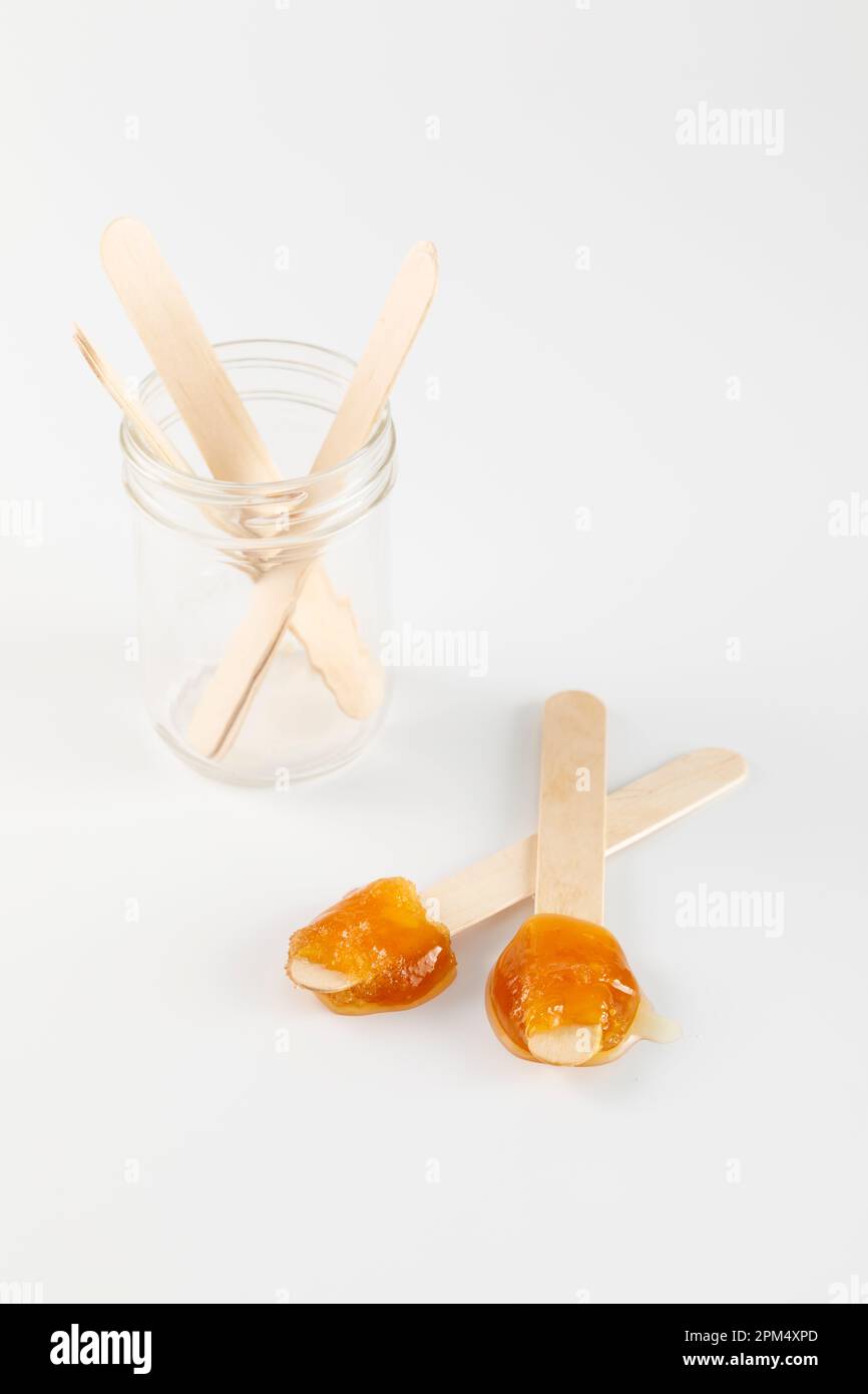Maple taffy on wooden stick Stock Photo Alamy