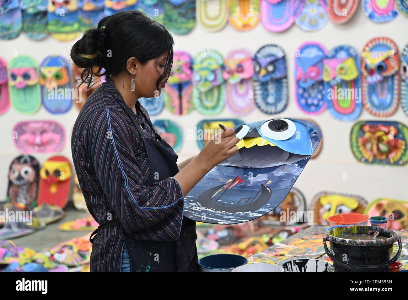 Dhaka, Bangladesh. 11th Apr, 2023. Student of Faculty of Fine arts of Dhaka University painting masks for colorful preparation to celebrate upcoming Bengali New Year in Dhaka, Bangladesh, on April 11, 2023. Pahela Baishakh (the first day of the Bangla month) can be followed back to its origins during the Mughal period when Emperor Akbar introduced the Bangla calendar to streamline tax collection while in the course of time it became part of Bengali culture and tradition. (Photo by Mamunur Rashid/NurPhoto) Credit: NurPhoto SRL/Alamy Live News Stock Photo