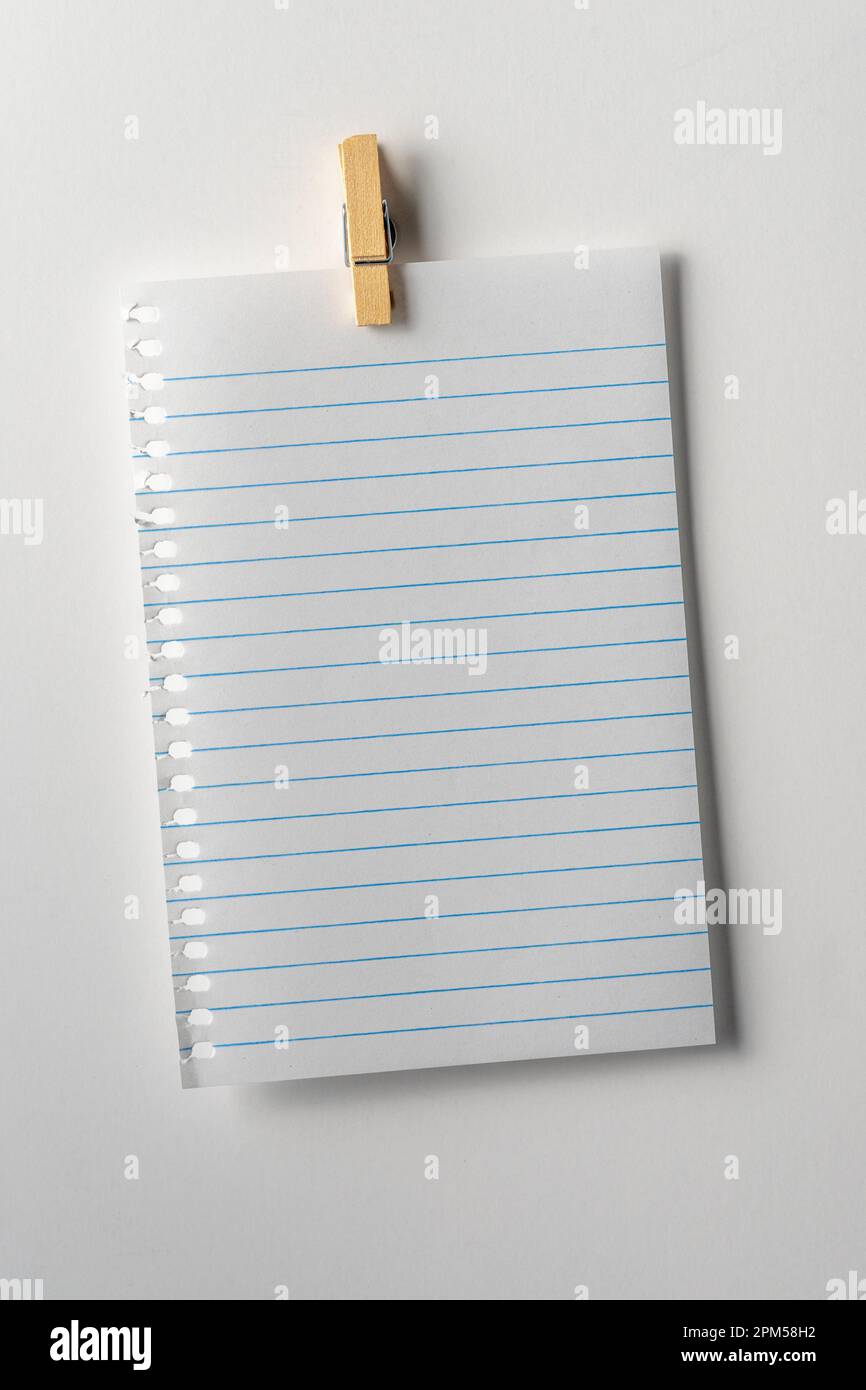 Blank note page paper on white background. Copy space. Close up. Stock Photo
