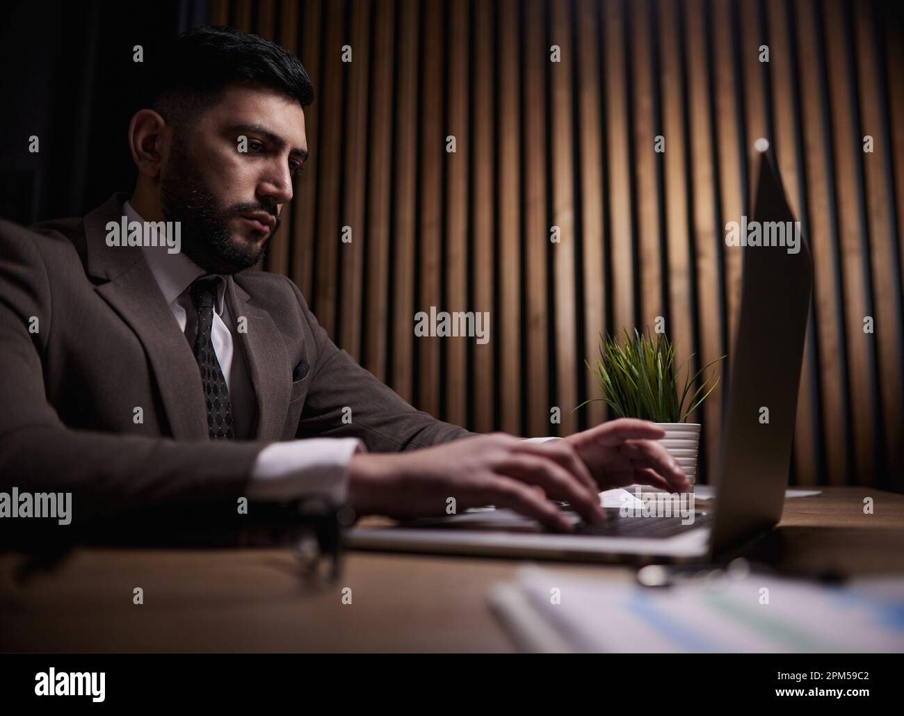 Man working on a laptop in the office Stock Photo