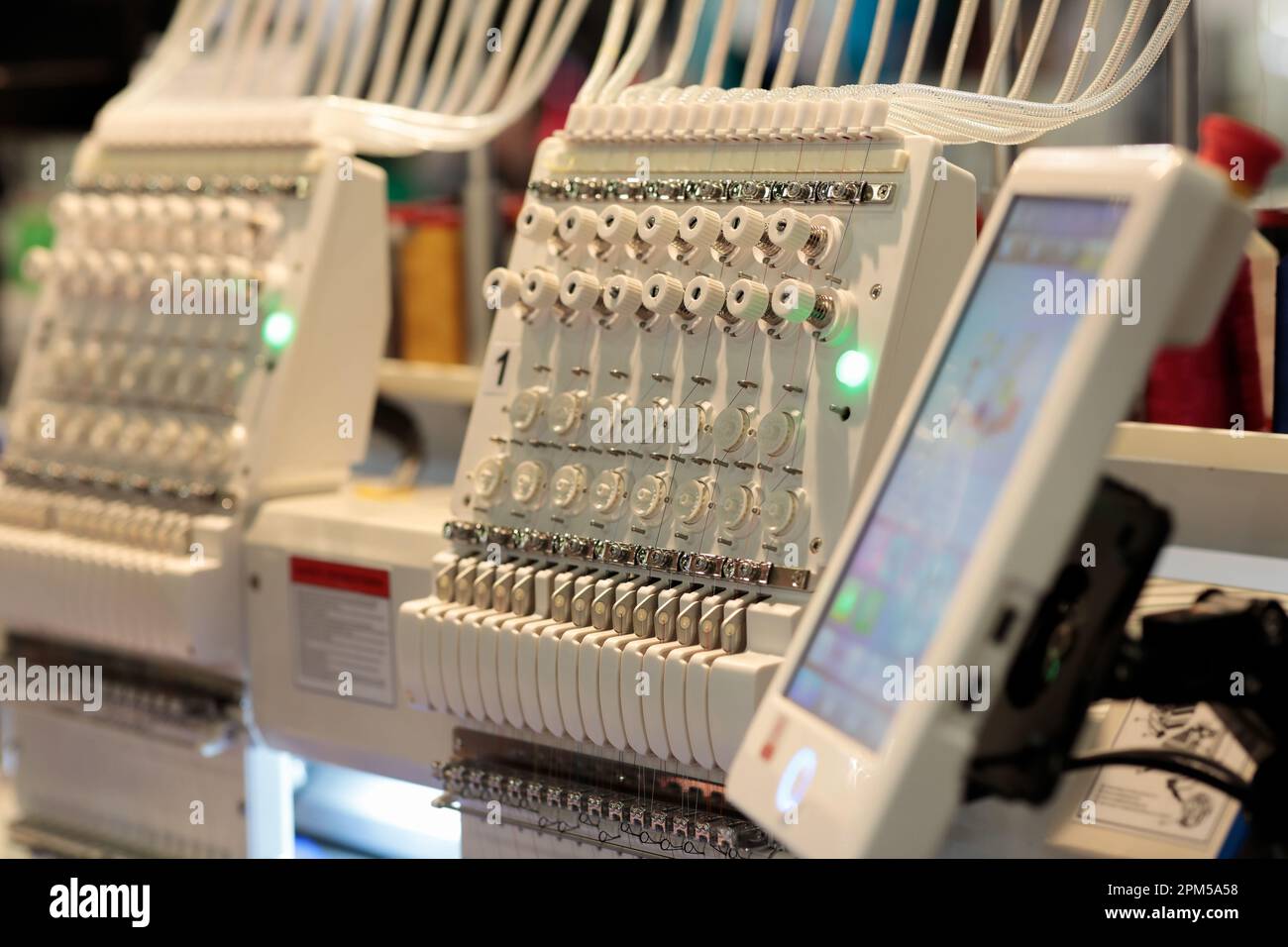 Industrial computerized embroidery machine with touch screen control
