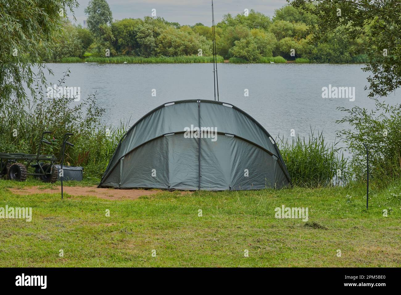 Beautiful landscape with a lake and in the fore ground a fisherman's shelter. Stock Photo