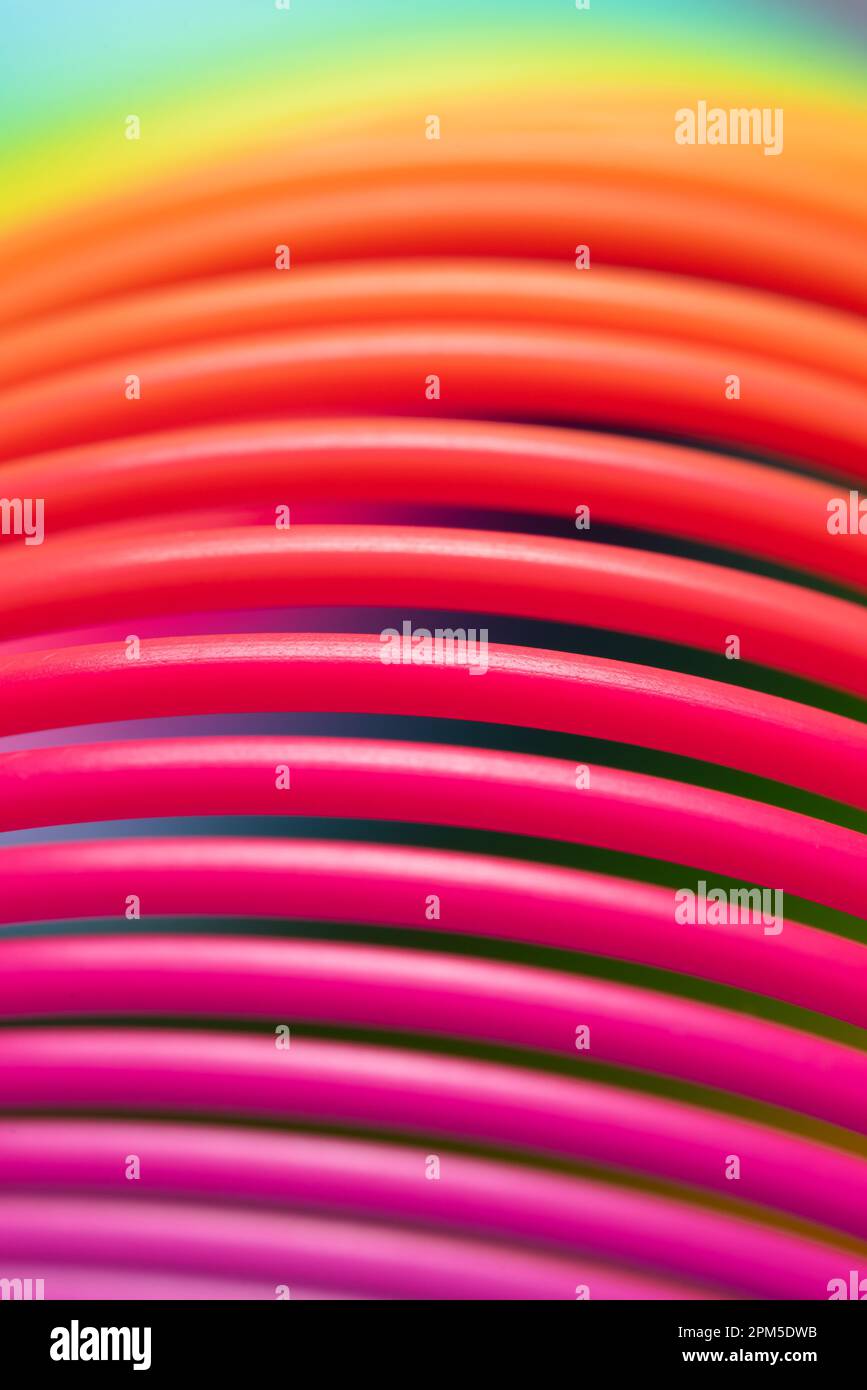 Details of a rainbow coloured plastic toy Stock Photo - Alamy