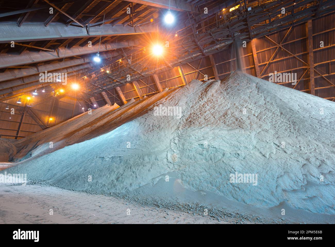 Copper concentrate being stored in a warehouse Stock Photo