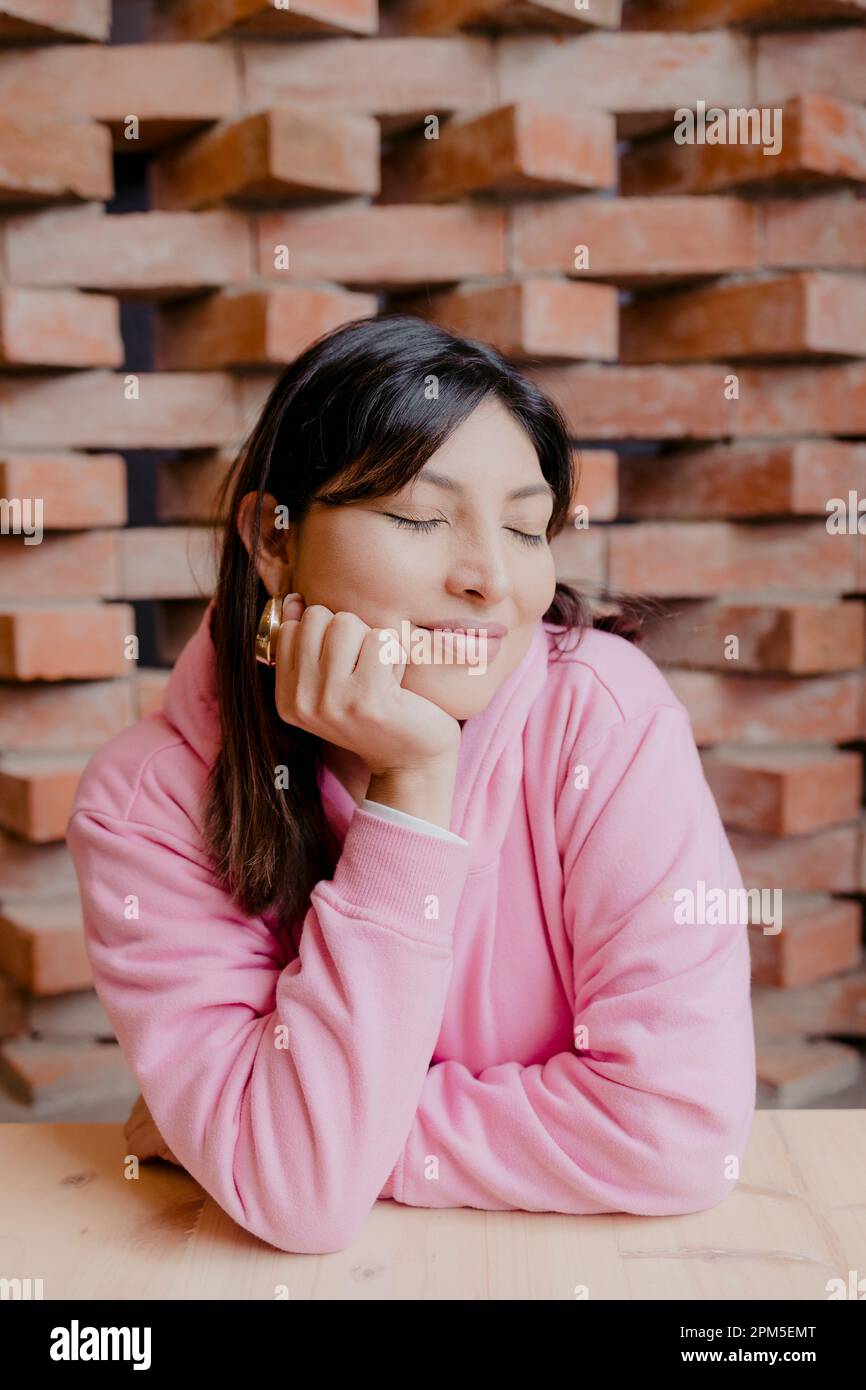 portrait of an hispanic woman  smiling with eyes closed Stock Photo