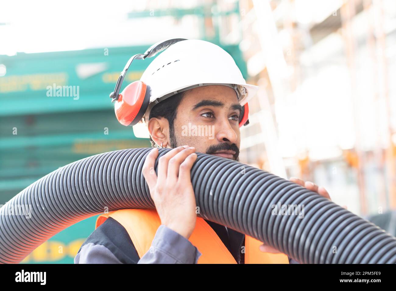 young technician safety glasses and helmet working Stock Photo